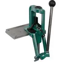 A green and black machine is sitting on the floor